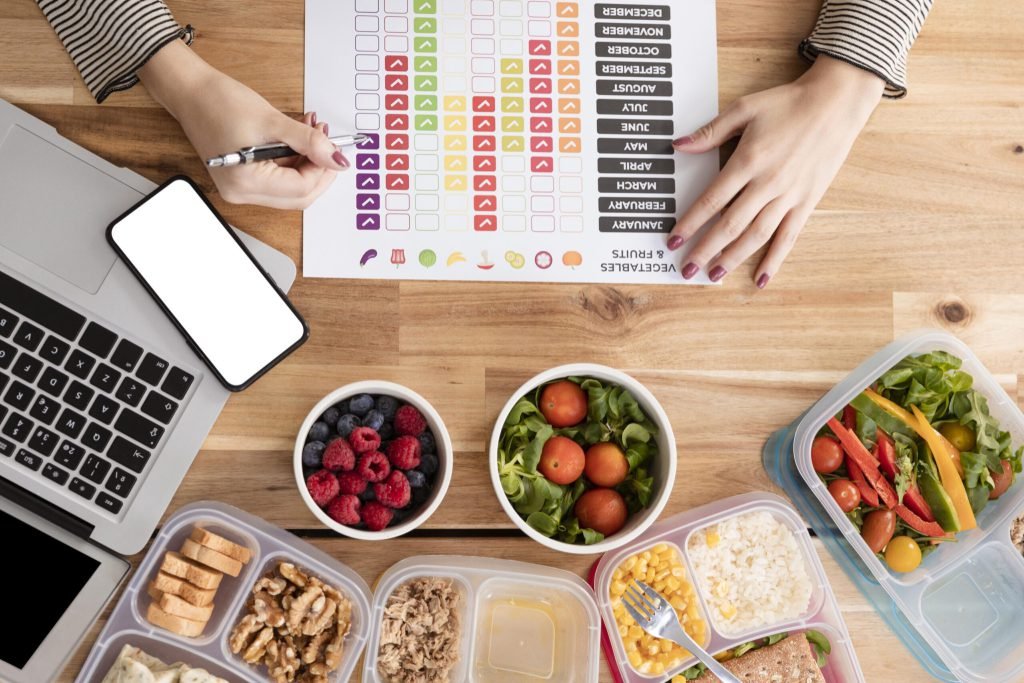 Flat lay charts organic food lunch boxes