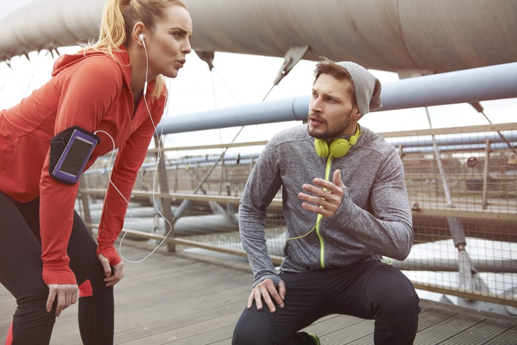 Happy couple exercising outdoors