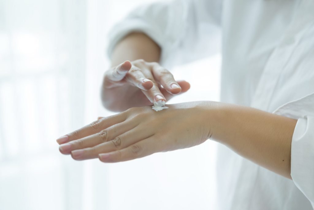 Woman holds jar with cosmetic cream her hands