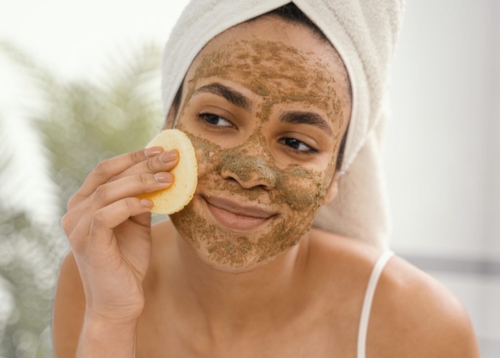 Young woman having homemade mask her face