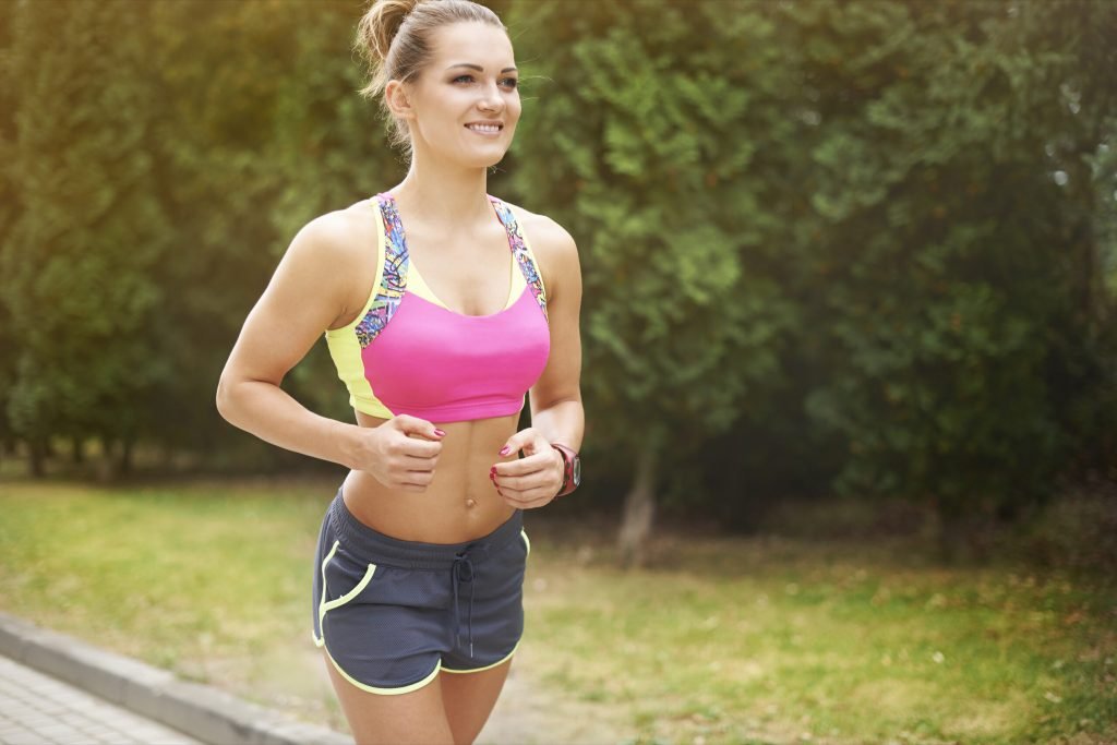 Young woman jogging running outdoor finding aim is crucial sport