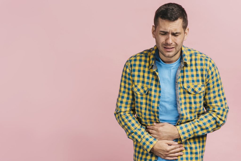Man having bellyache with copy space