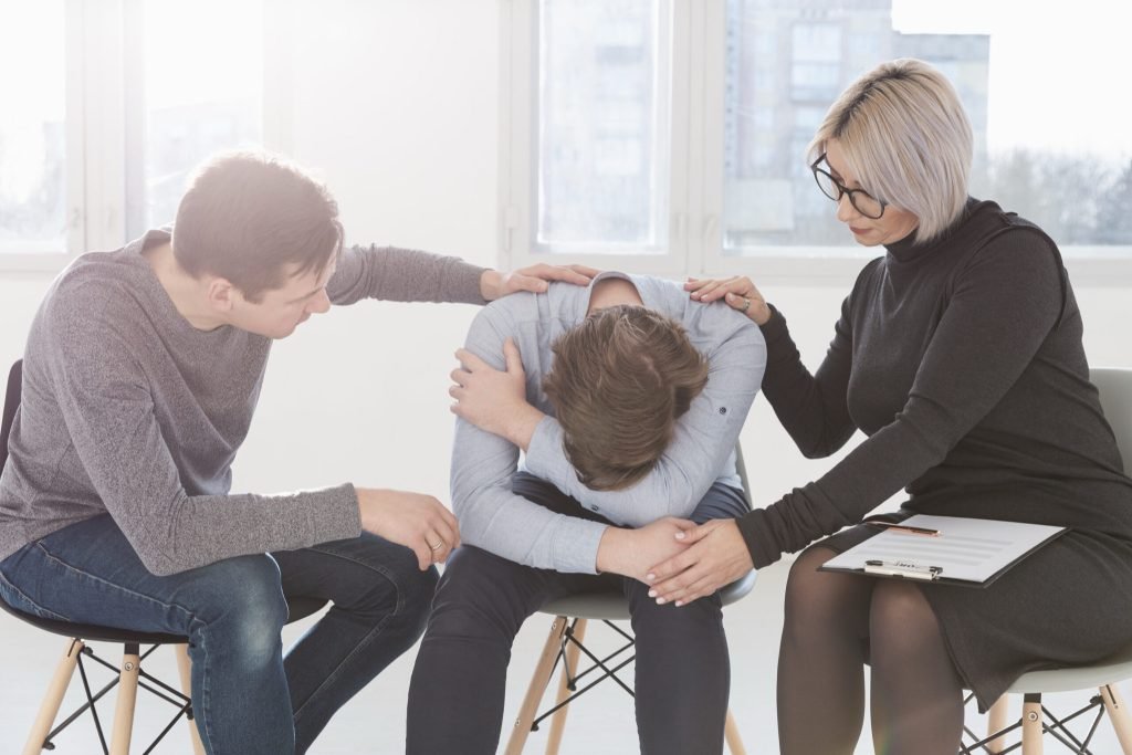 Man woman trying console patient