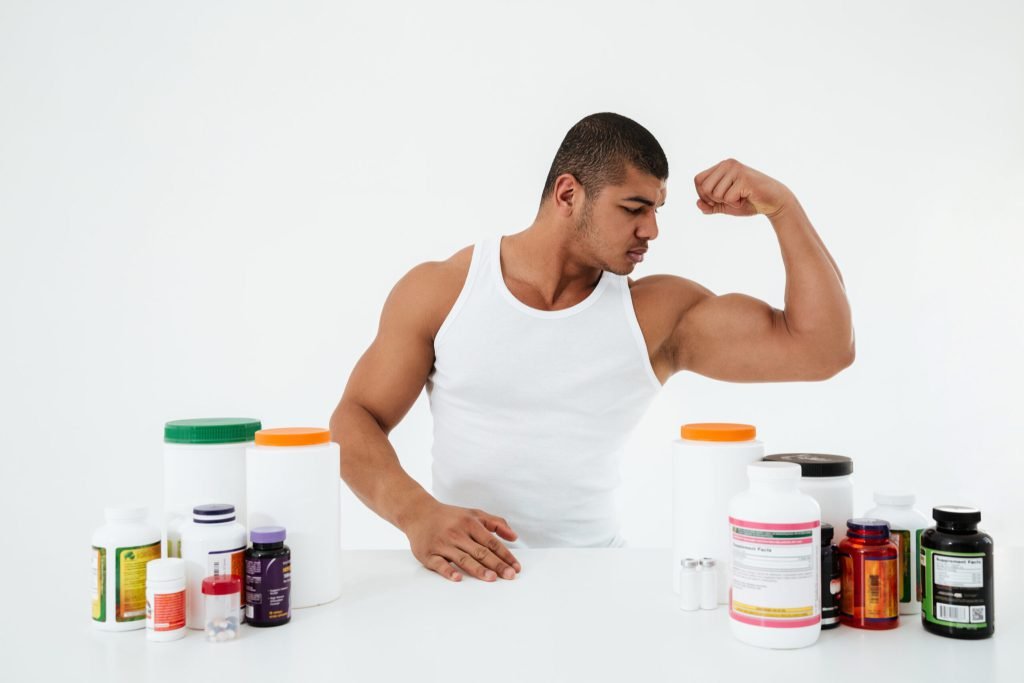 Sportsman showing his biceps