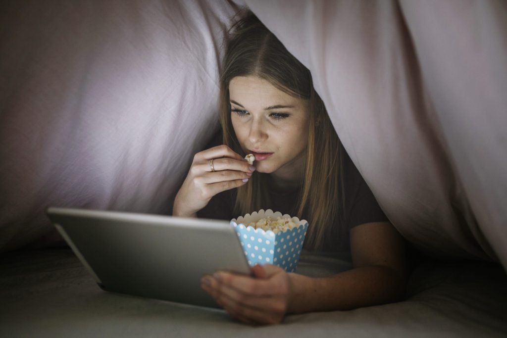 Woman watching film tablet