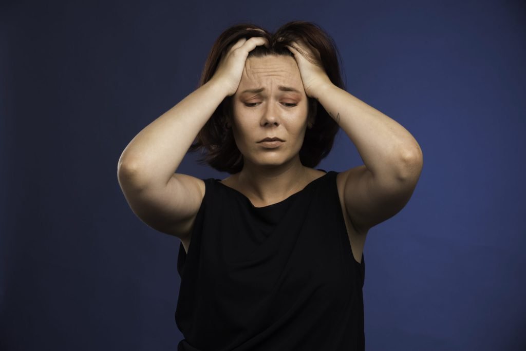 Young girl black shirt putting her head