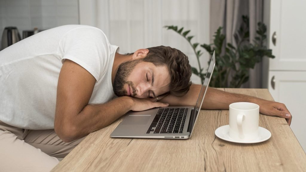 Sideview adult male tired after working too much