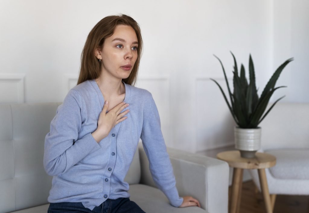 Side view woman breathing home