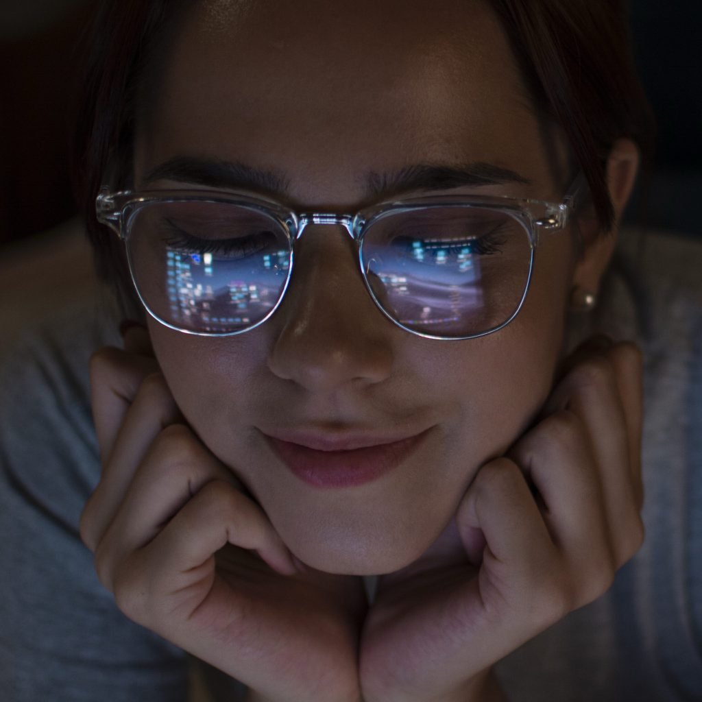 Portrait woman looking laptop late night
