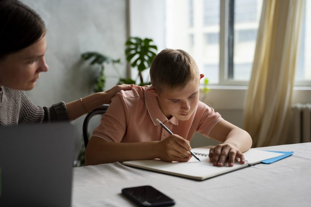 Side view boy woman with laptop