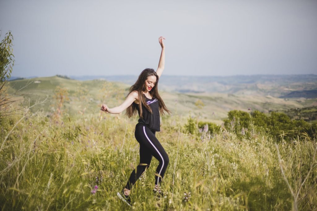 Pretty woman dancing nature