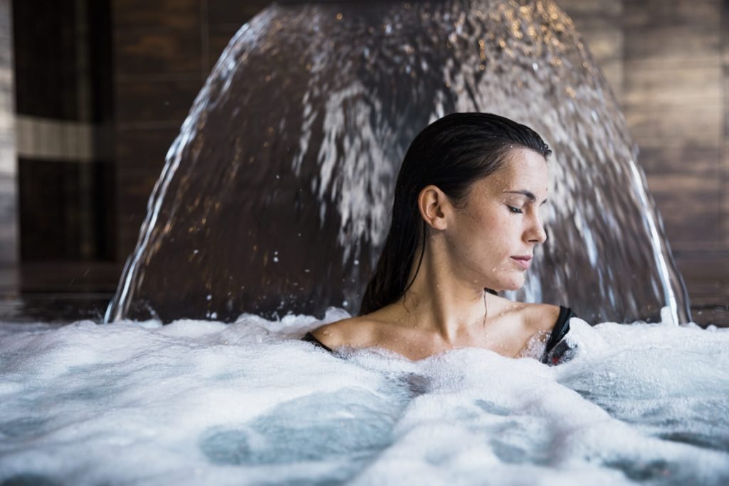 Spa concept with woman relaxing water