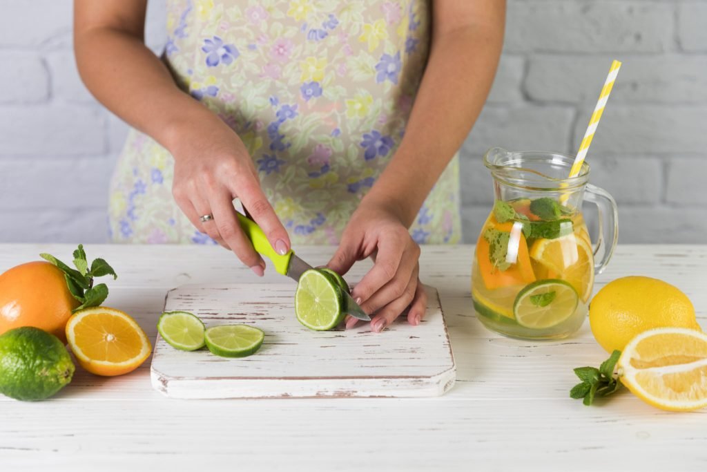 Woman preparing homemade lemonade