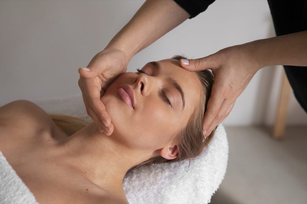 Female masseur giving back massage client