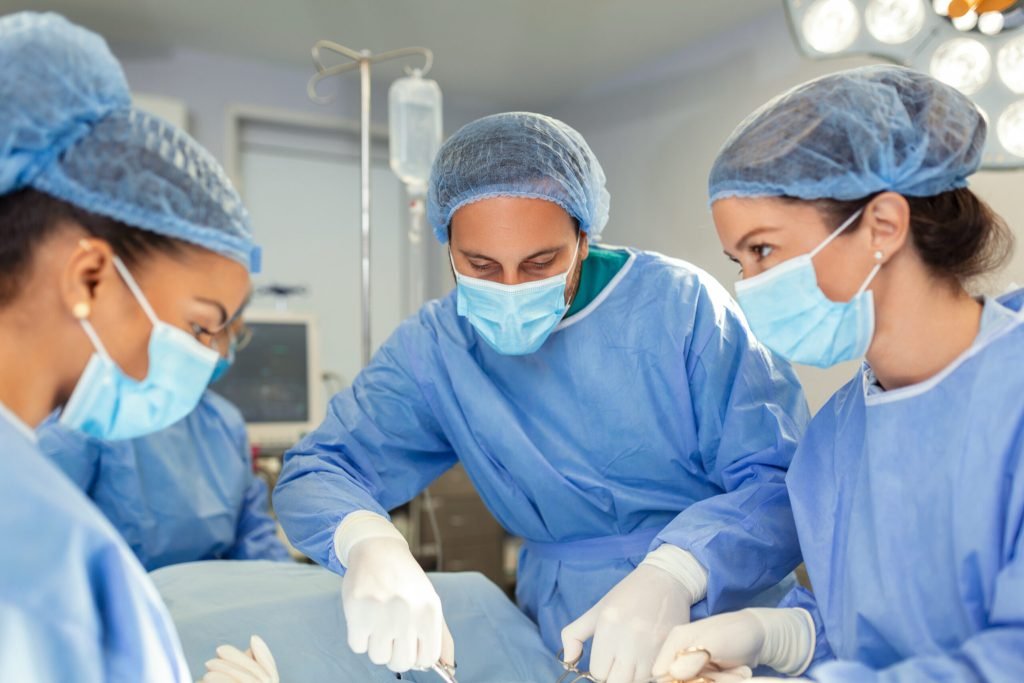 Group surgeons doing surgery hospital operating theater medical team doing critical operation group surgeons operating roo...