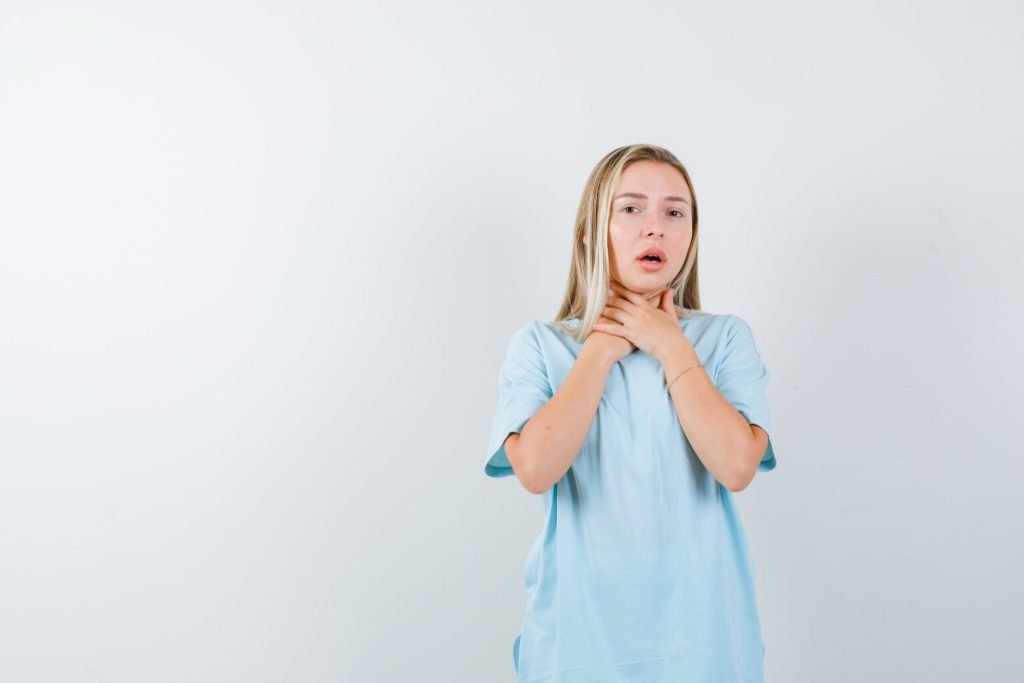 Portrait young lady suffering from throat pain t shirt isolated