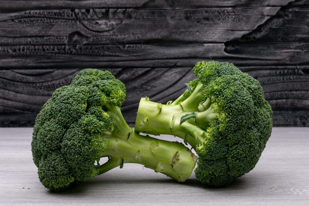 Fresh broccoli white wood table