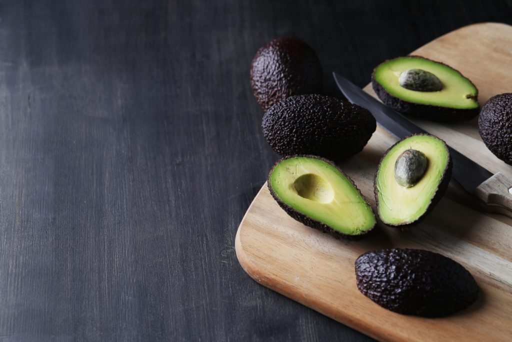 Green avocados cutting board
