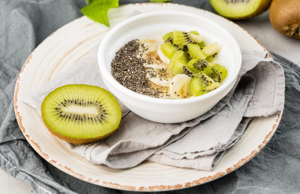 Close up delicious breakfast with kiwi milk
