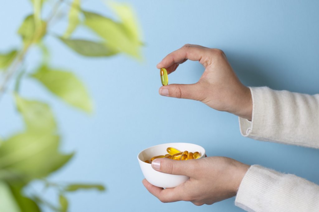 Close up hand holding pills bowl