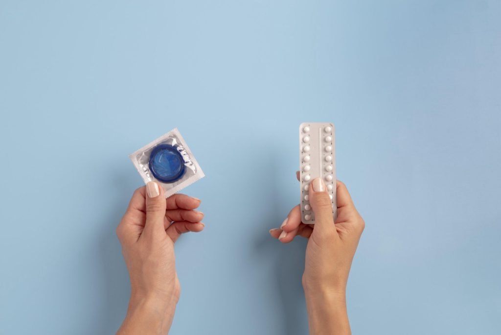 Close up hands holding condom pills