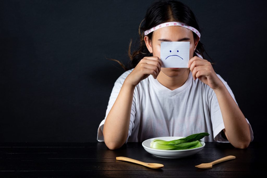 Depressed woman hungry from dieting