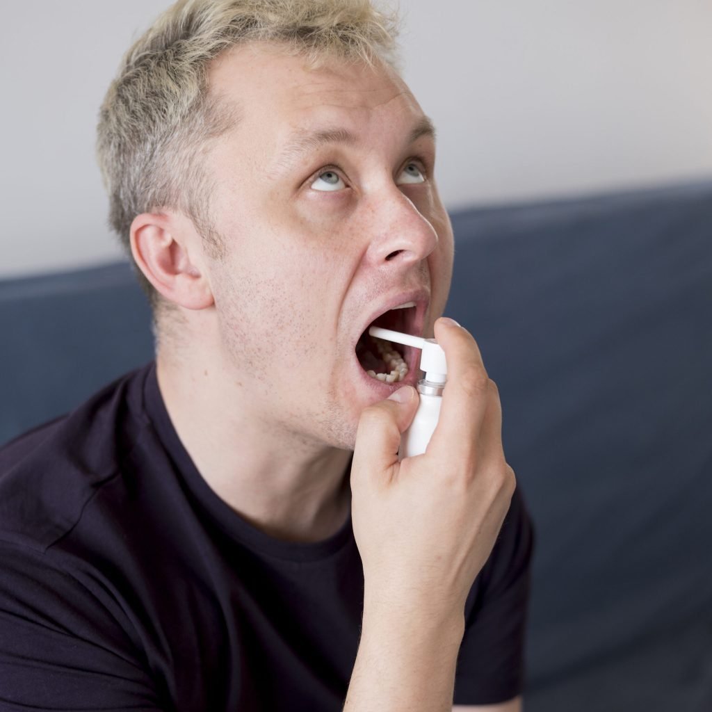 Man using treatment sore throat