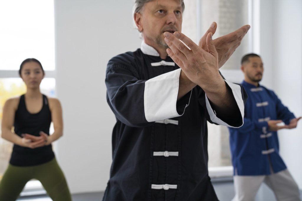 Medium shot people practicing tai chi