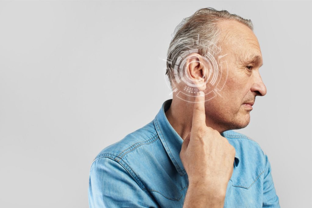 Side view man experiencing hearing issues