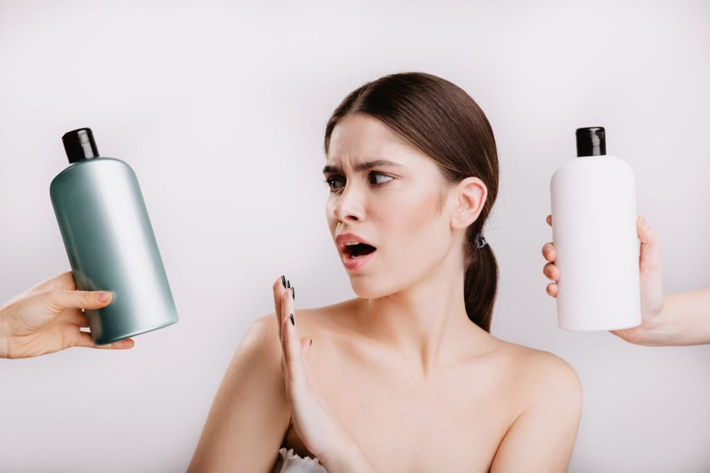 Snapshot beautiful lady white wall girl refuses use shampoo with chemicals favor natural