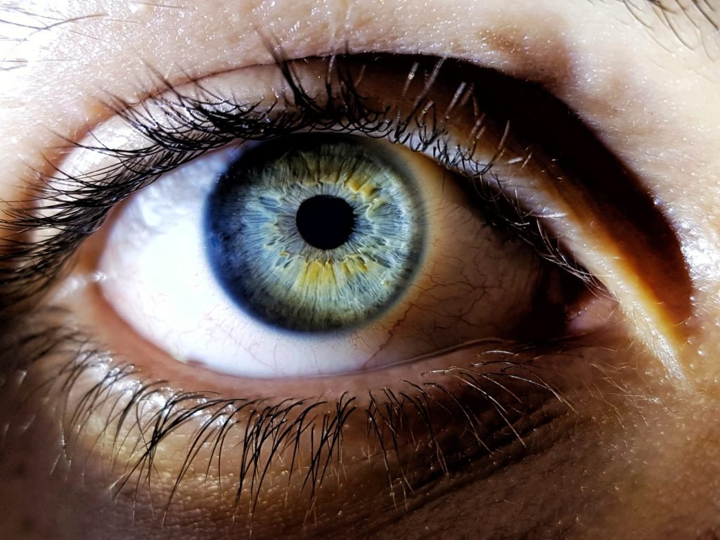 Beautiful closeup shot female human s deep blue eyes