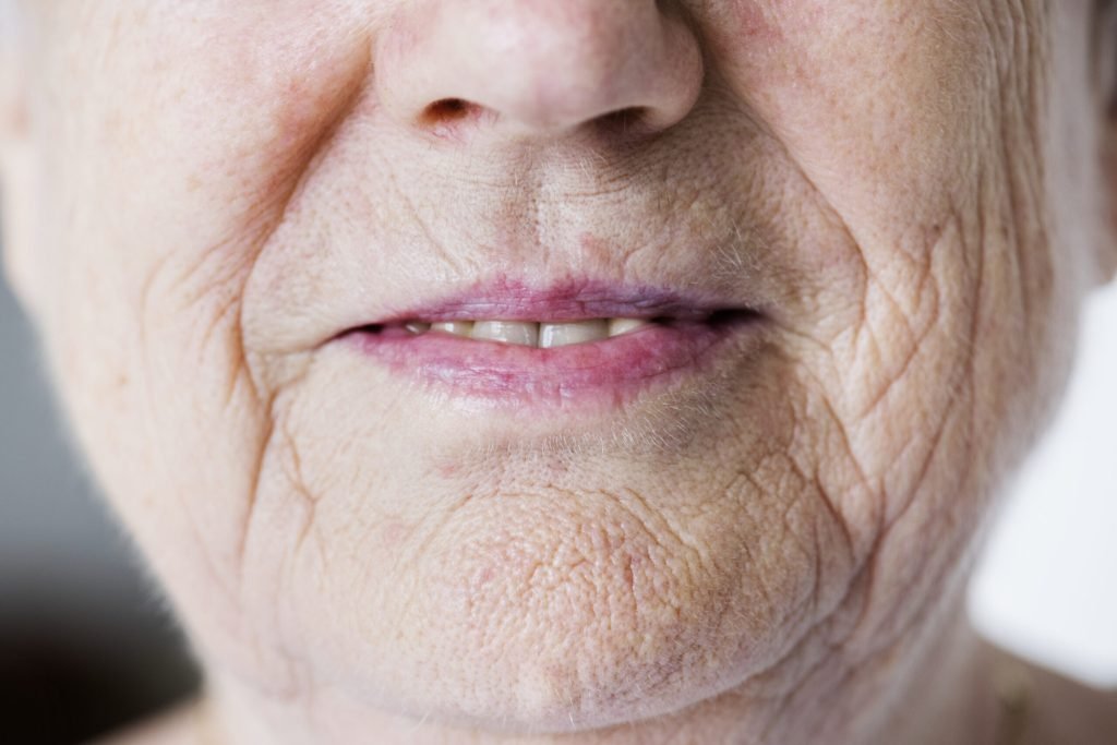 Portrait white elderly woman closeup smiling lips