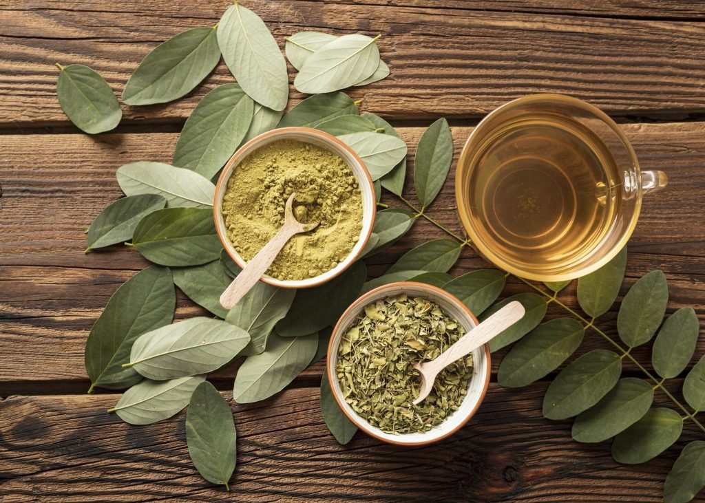 Top view cup tea natural herbs leaves