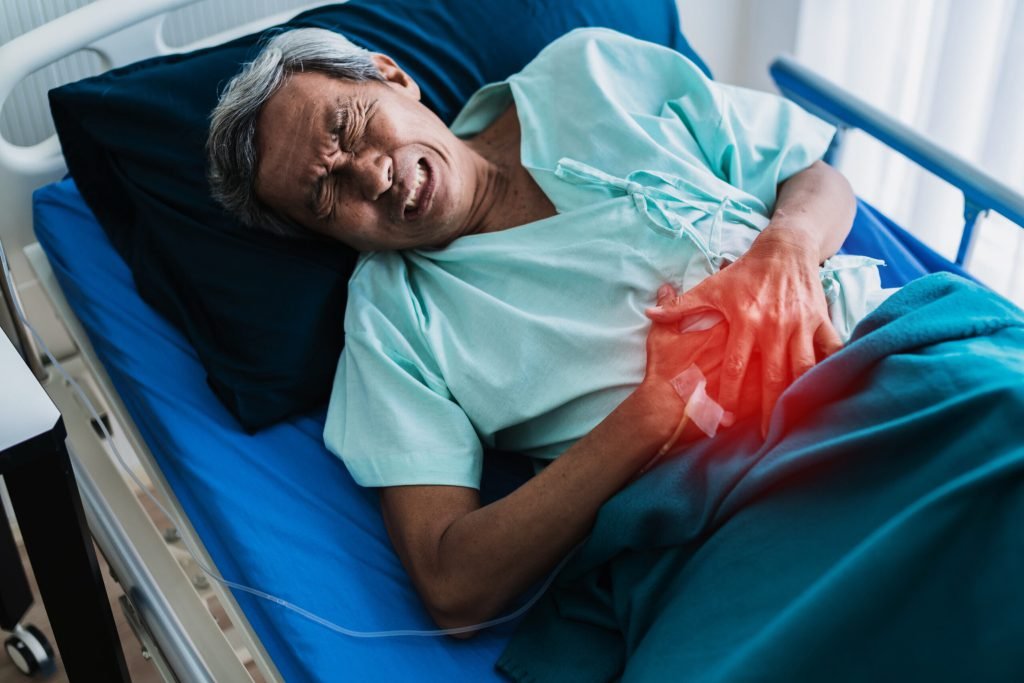 Pain stomache old senior asian grandfather patient uniform suffer from body problem health ideas concept