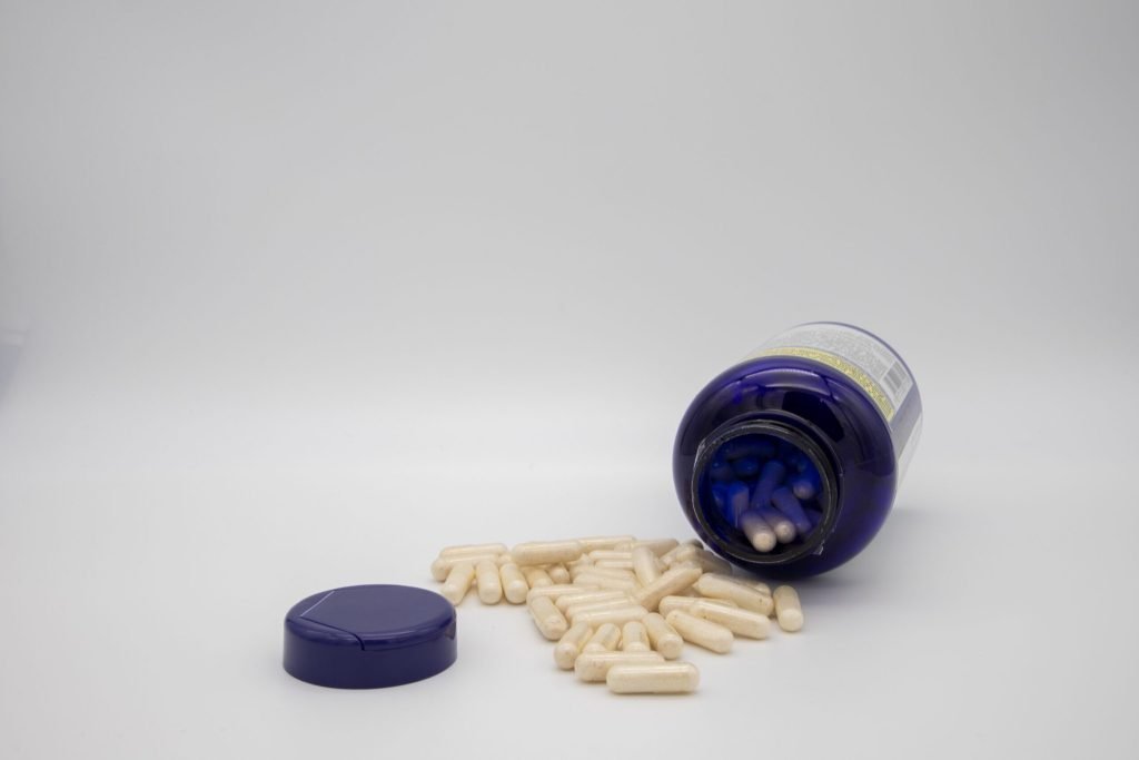 White tablets from blue pill bottle
