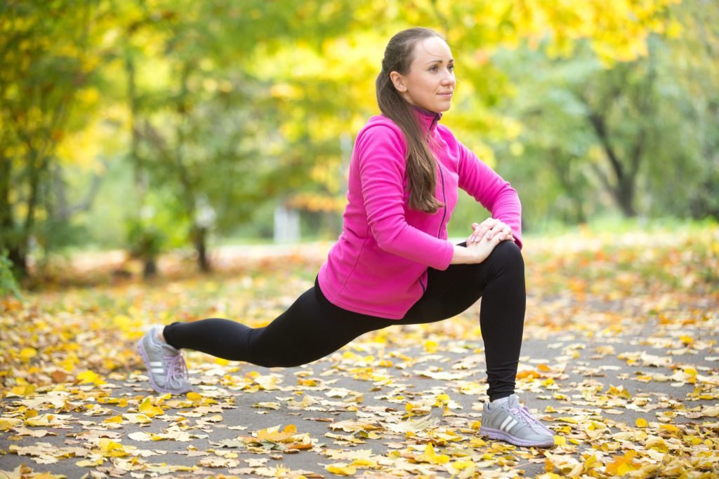Autumn fitness outdoors high lunge exercises