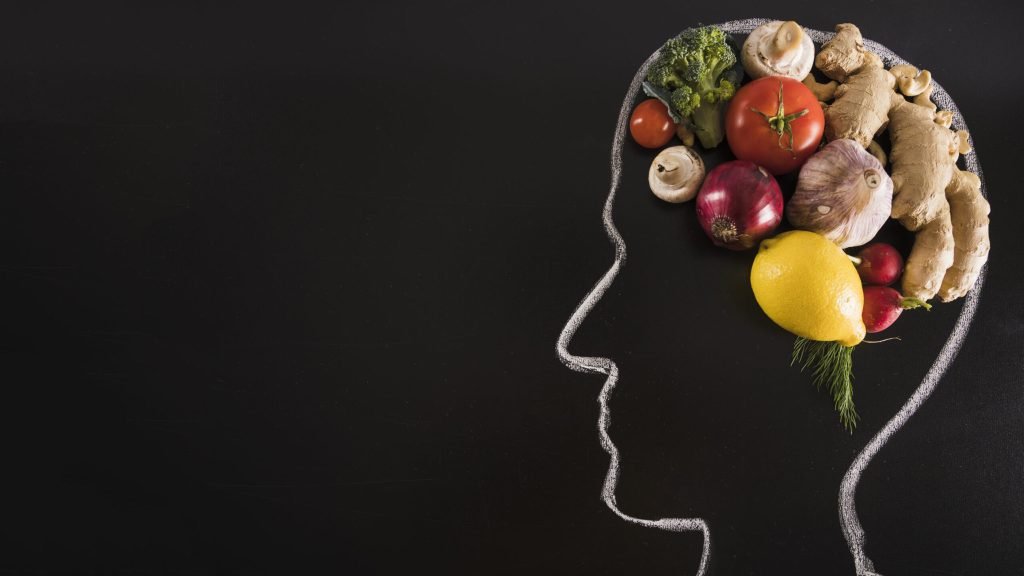 Chalk drawn human head with healthy food brain blackboard