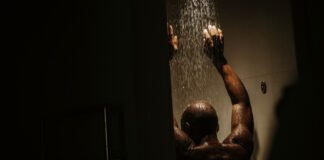 What is ‘Dark Showering’ and Can It Really Help You Sleep Better?