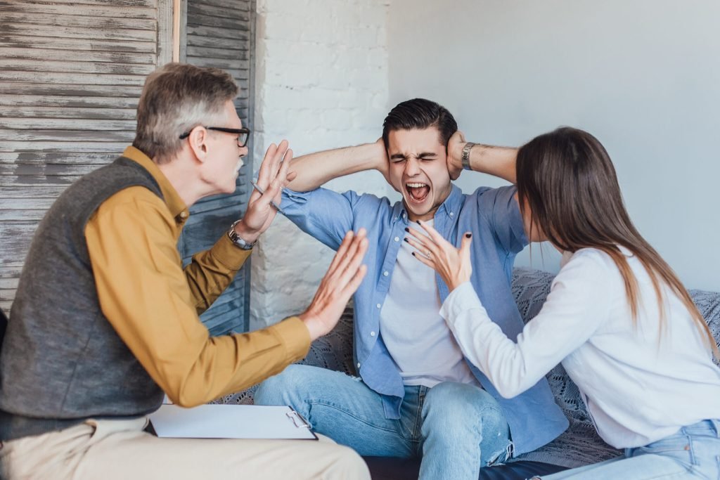 Young angry couple after therapy session with family psychologist